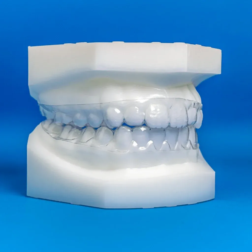 A pair of clear retainers with their archived case file