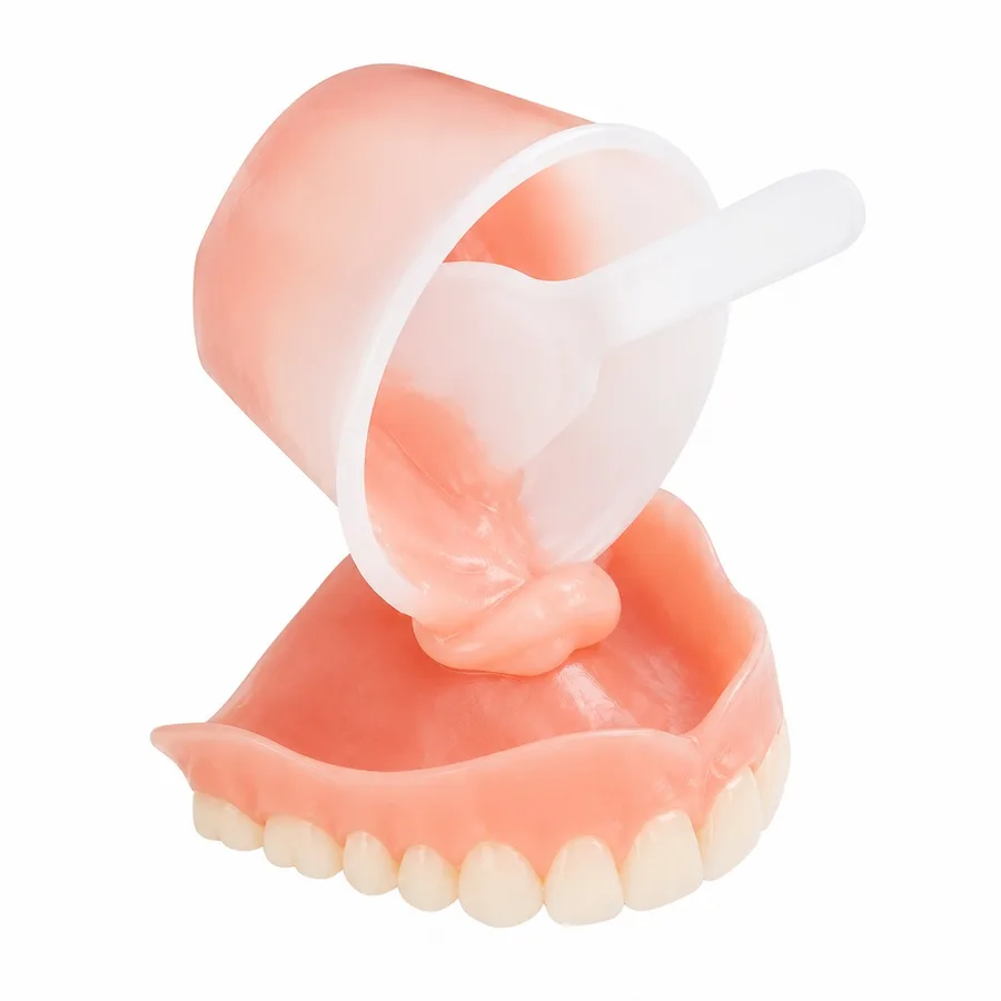 Denture with a fresh reline material on the tissue surface
